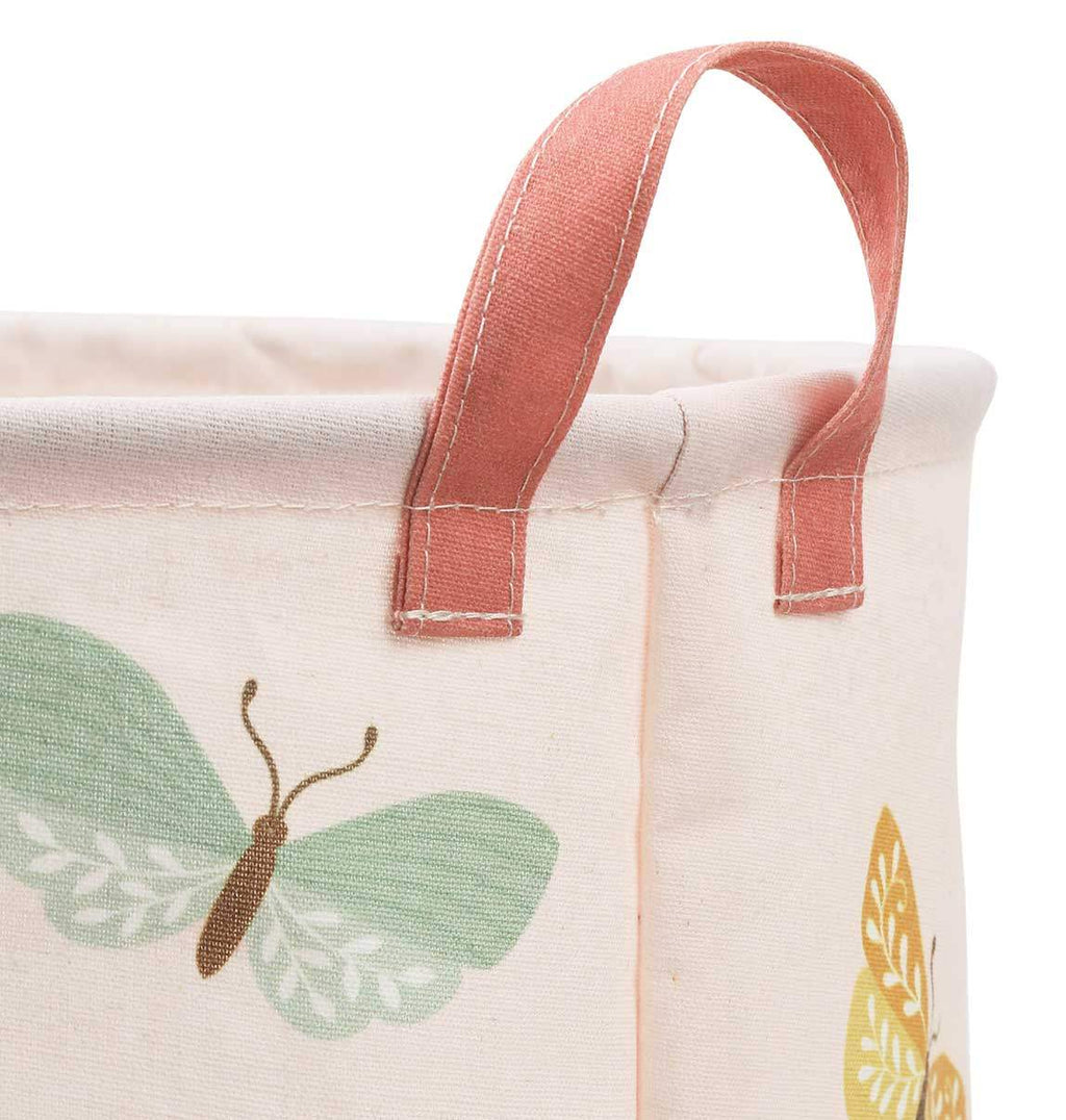Canvas laundry basket with butterfly pattern on a white background