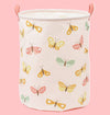 Canvas laundry basket with butterfly pattern on a white background
