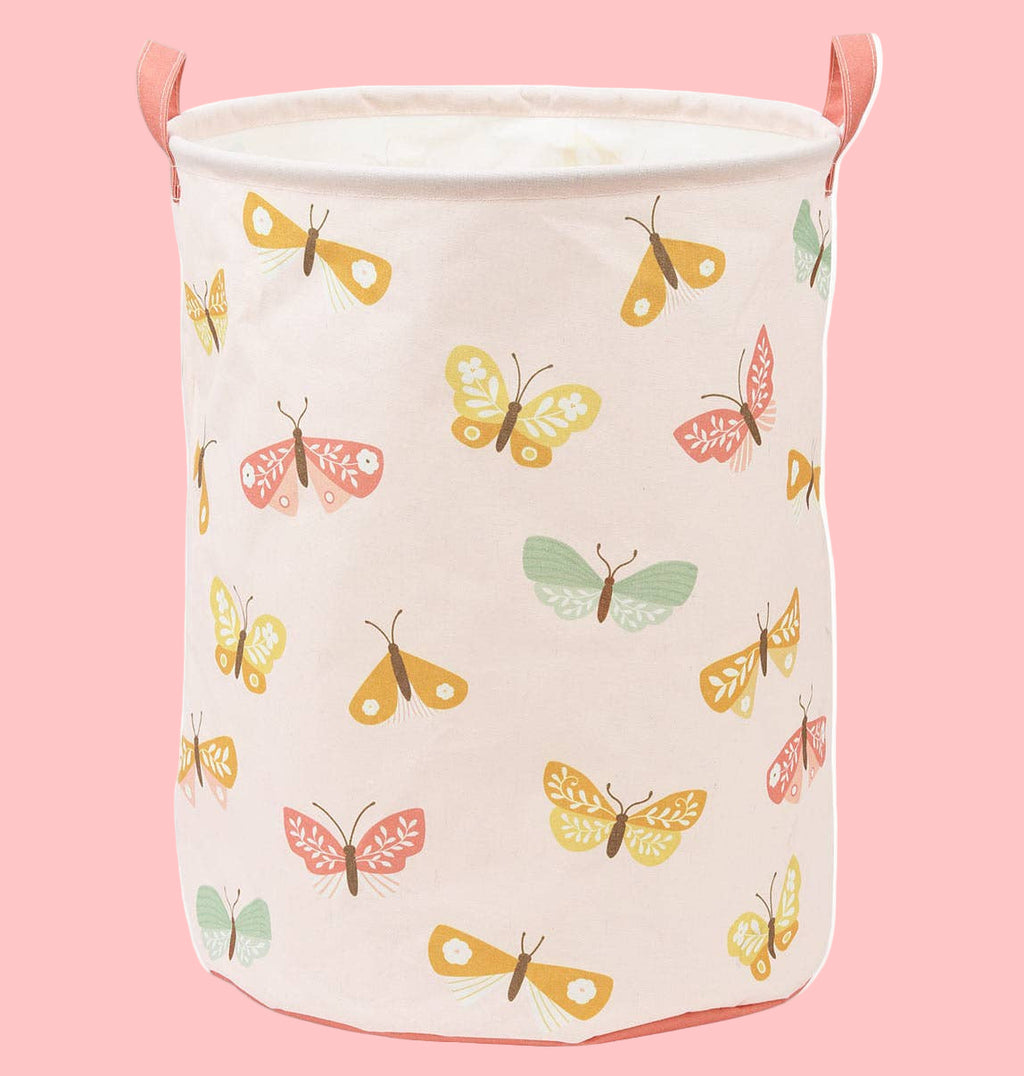 Canvas laundry basket with butterfly pattern on a white background